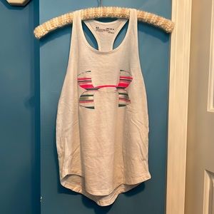 Workouts will be a breeze with this light and breezy tank top with the logo.